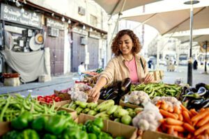 A woman with a sense of wonder, representing the discovery of hidden treasures within Dubai's vibrant cityscape